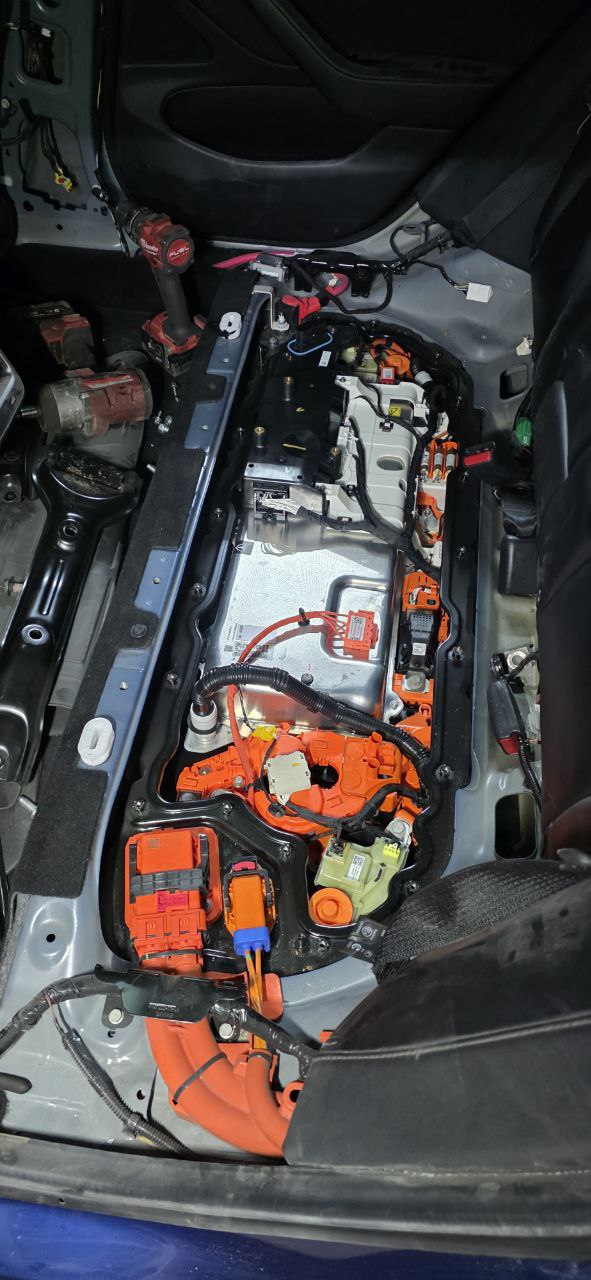 Tesla Model 3 battery penthouse opened showing HV components and pyrofuse