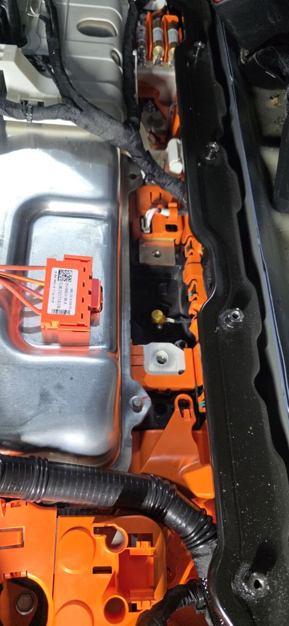 Tesla Model 3 pyrofuse component with QR code label and HV busbars