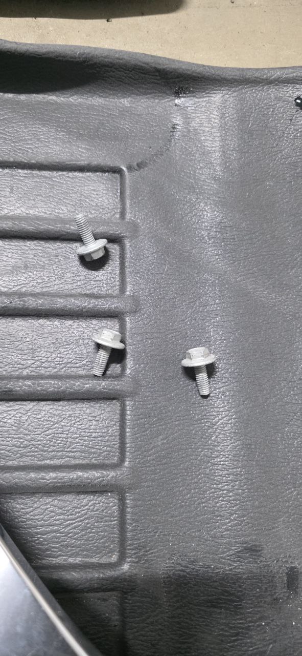 Old and new Tesla Model 3 side mirrors with wiring harnesses