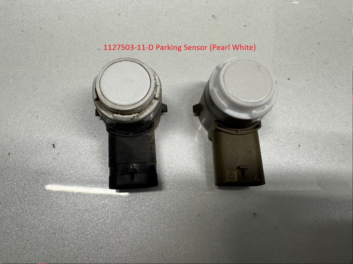 Reader photograph of two parking sensor faces, with black and brown housings; back labels are not shown