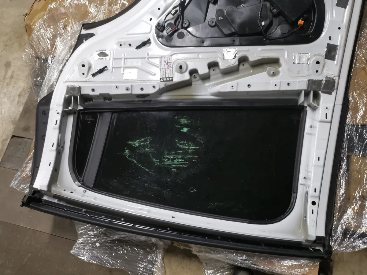 Tesla door panel interior showing inner structure and mechanisms